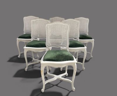 set of six white cane back chairs with green cushions