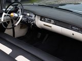 a black and white car with a steering wheel and dashboard