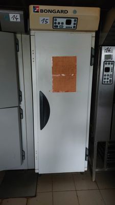 a picture of a refrigerator in a kitchen with the door open