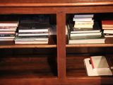 a book shelf with many books on top of it