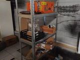 a room that has a bunch of shelves and boxes on it