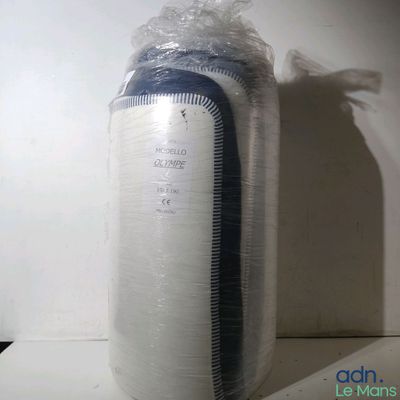 a bag of toilet paper sitting on a shelf next to a wall