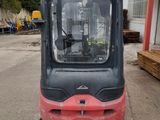 a forklift that is parked in front of a building