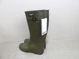 green rubber boots with a tag on them sitting on a white surface
