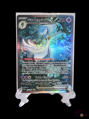a close up of a pokemon card on a stand on a black background