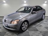 a picture of a mercedes c - class in a showroom