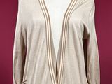 a woman ' s beige cardigan sweater on a mannequin mannequin mannequin mannequin mannequin mannequin mannequin mann