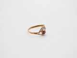 a close up of a ring on a white surface