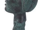 statue of a woman ' s head with a hat on a base