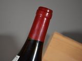 a bottle of wine that is sitting on a table