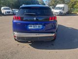 a blue car that is parked in a parking lot
