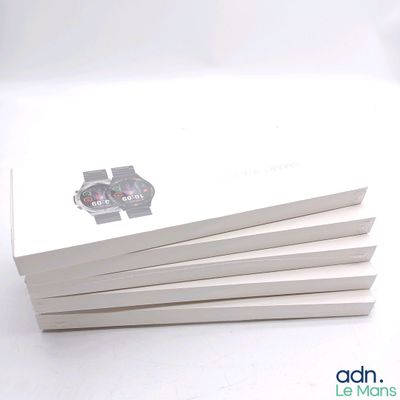 several white books with a picture of a car on them