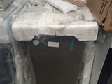 a refrigerator that has been wrapped up and is sitting in the middle of a pile of boxes