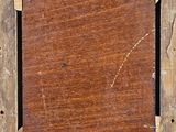 a picture of an old wooden picture frame on the wall
