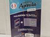a clear plastic folder with a blue label on the front of it