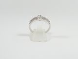 a white gold ring with diamonds on a white background