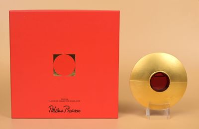 a red box with a gold object in it next to a red box