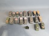a lot of toy army vehicles that are sitting on a table