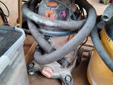 an image of a vacuum and other tools in a garage