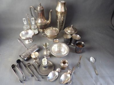 a lot of silverware on a table with spoons and spoons