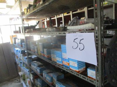 a sign that says 55 on a shelf in a store