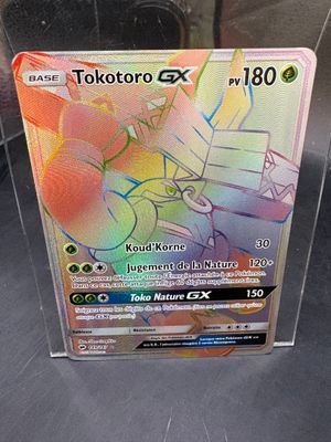 a pokemon card in a clear box on a table