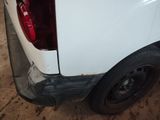 a white truck that has been painted white and is parked in a garage