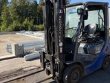 a forklift that is parked on the side of the road