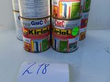 two cans of canned food on a table with a price tag