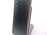 a black phone that is sitting on top of a stand