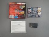a video game on the table next to a game card