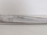 a knife that is sitting on a table in a room