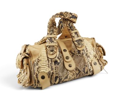 an image of a snake skin handbag on a white background
