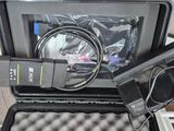 a black case with a camera and a cell phone in it