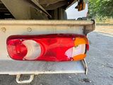 a red tail light on the back of a truck