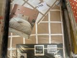 a box of bedding that is sitting on the floor