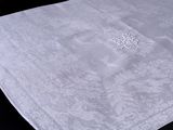 a white table cloth with a design on it