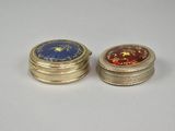pair of gold and blue enamel pill cases