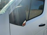 a white van that is parked on the side of the road
