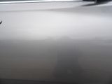 someone is taking a picture of their reflection in the door of a car