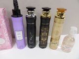 several different types of perfumes are lined up on a table