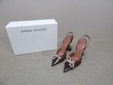 an image of a pair of women ' s shoes in front of a box