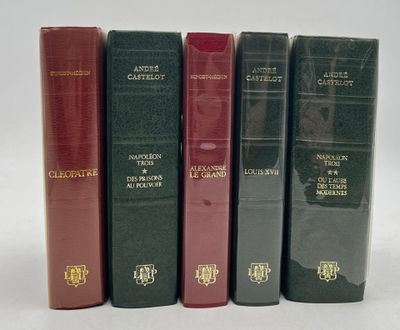 four books are lined up in a row on a white surface