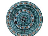 a blue and brown plate with a circular design on it