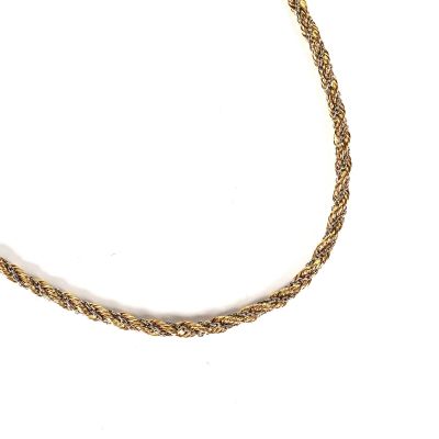 a close up of a gold rope necklace on a white background