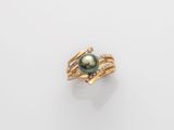 a black pearl and diamond ring