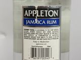 a bottle of appleton jamaica rum sitting on a table
