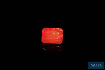 an image of a glowing red stone on a black surface
