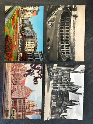 several old postcards of different buildings on a black surface