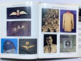 an open book with pictures of military items on it